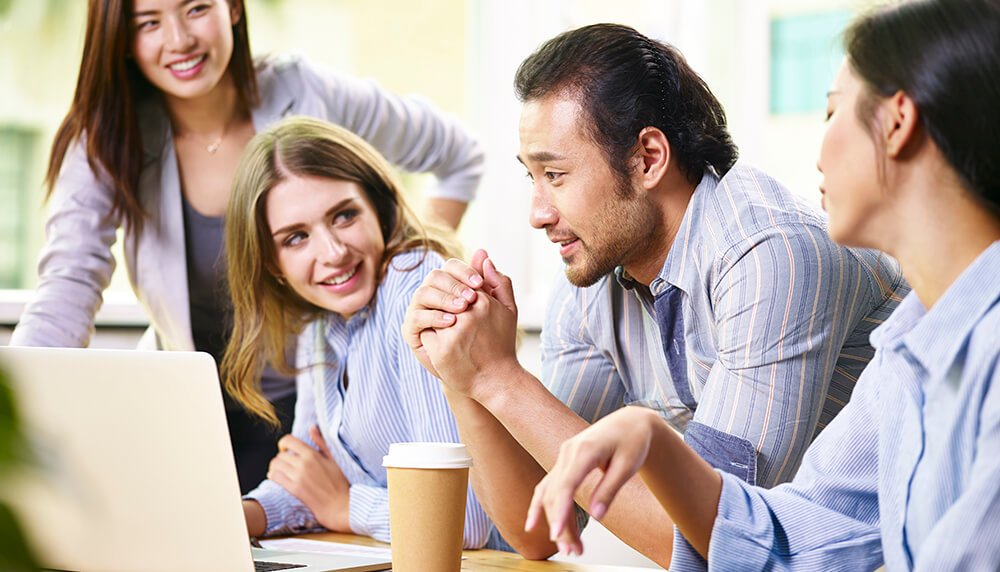 Did Your Strategic Plan Die on a Shelf? Group of people huddled around a computer